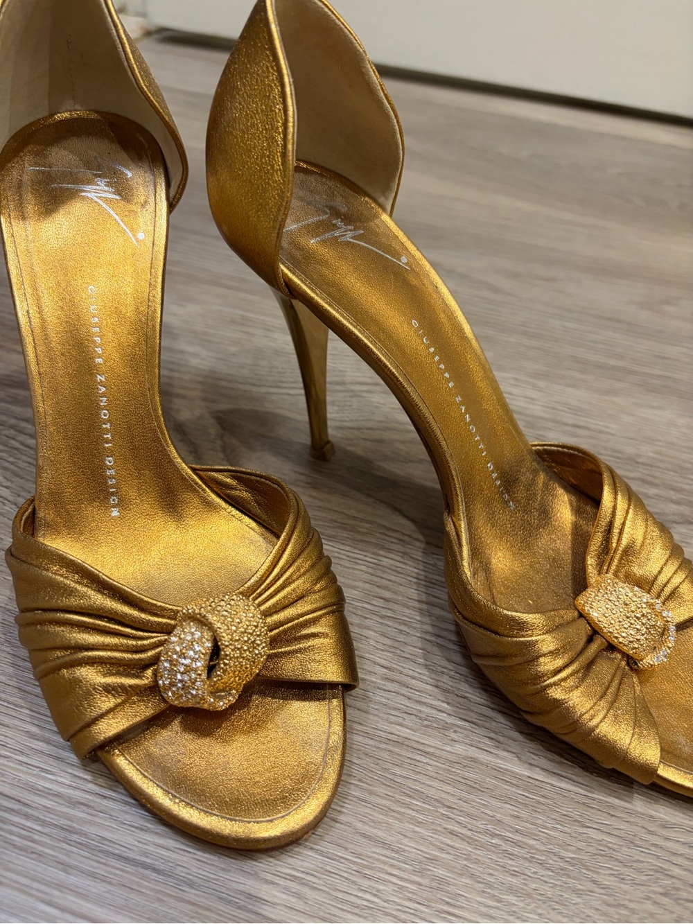 Giuseppe Zanotti Metallic Gold Knotted Satin D'Orsay Heels with Crystal Buckle